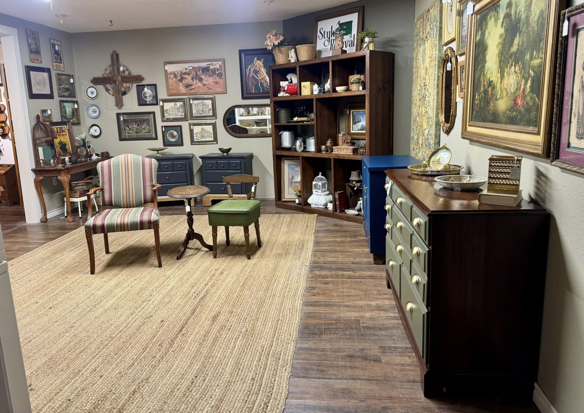 Style Revival booth filled with restored furniture, vintage art, and decor